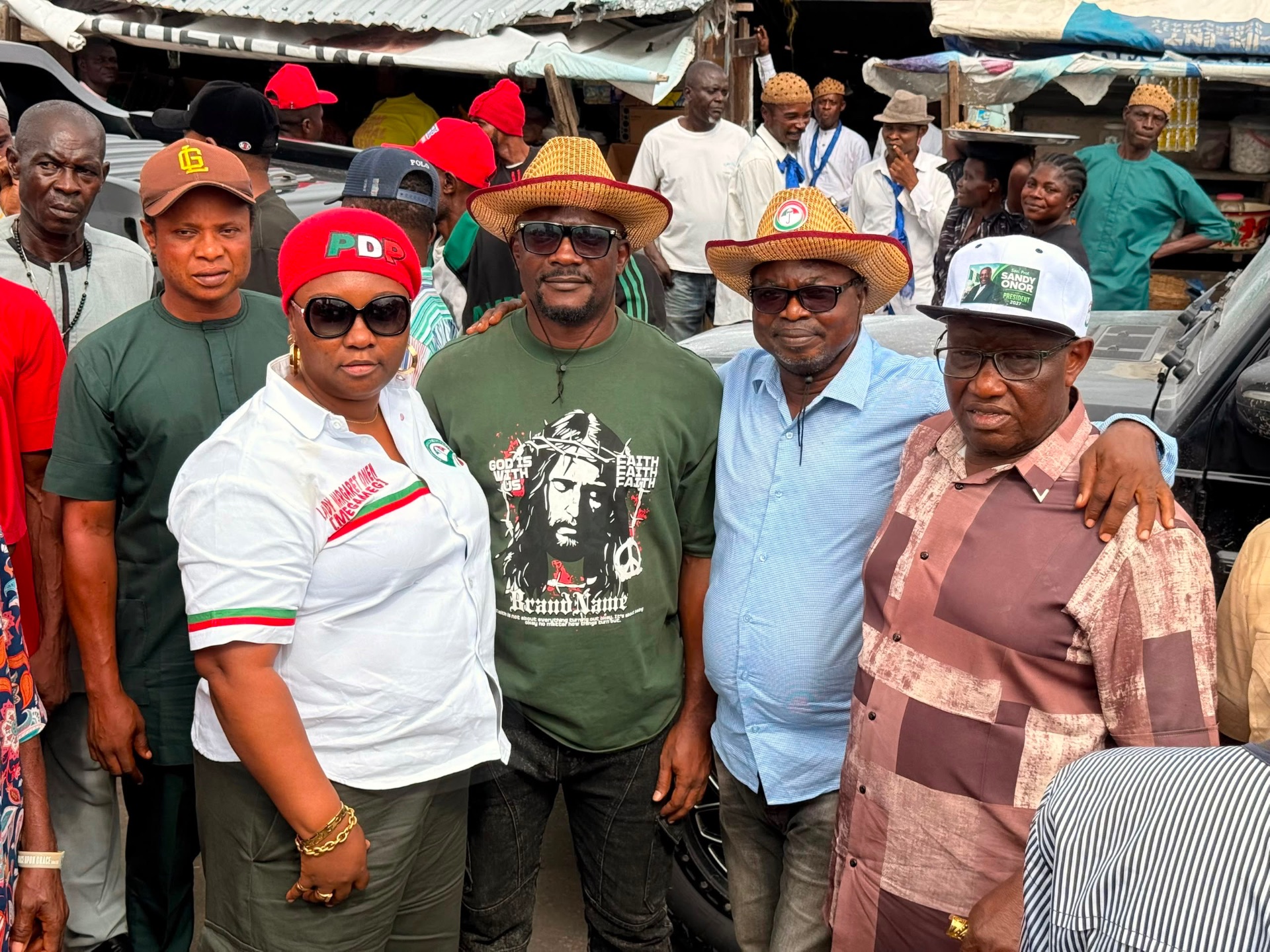 John Ifere with PDP supporters at a local market