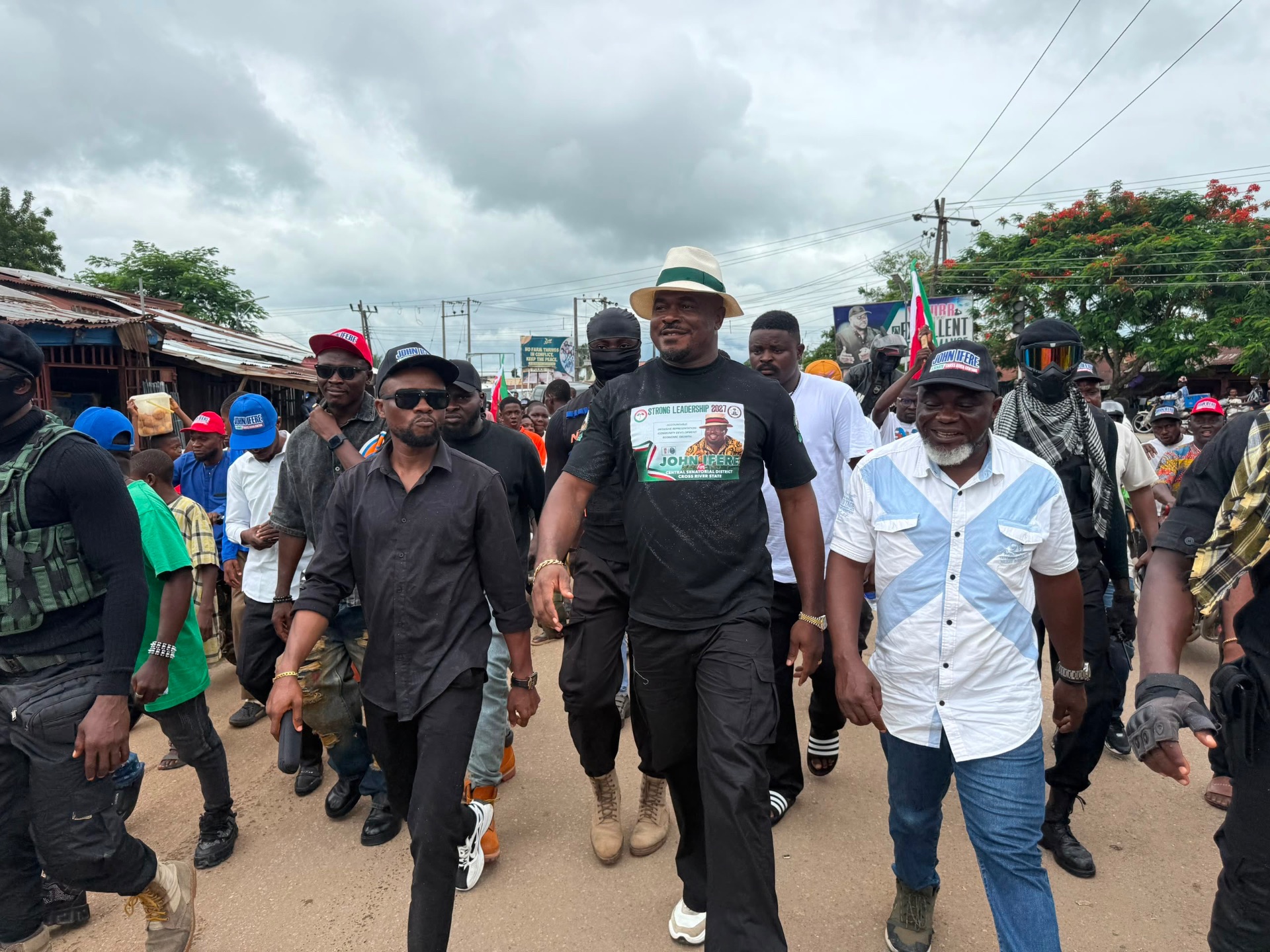 John Ifere walking through a rally crowd