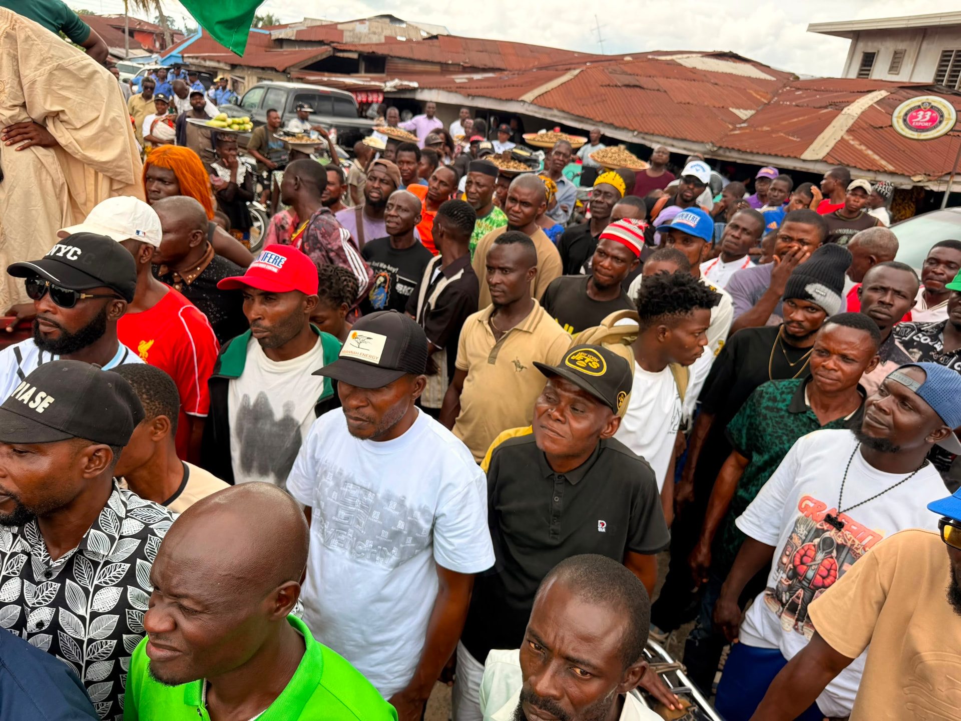 Dense crowd of supporters at a campaign rally